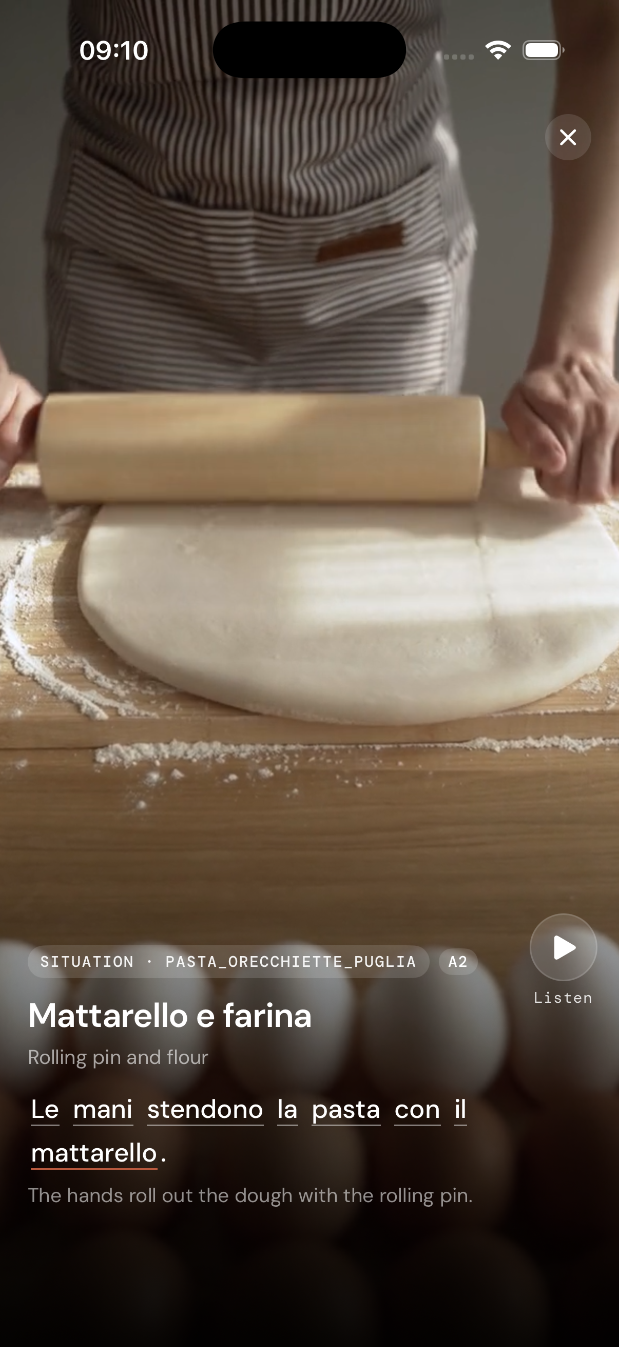 Describe scene showing a kitchen with a rolling pin, bilingual Italian and English caption below