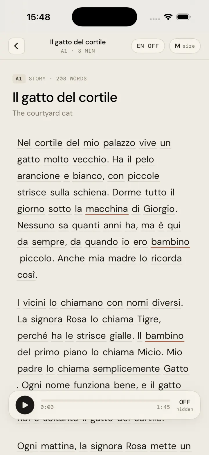 Story reader screen showing Il gatto del cortile, an Italian paragraph with tap-underlined words and an audio player at the bottom
